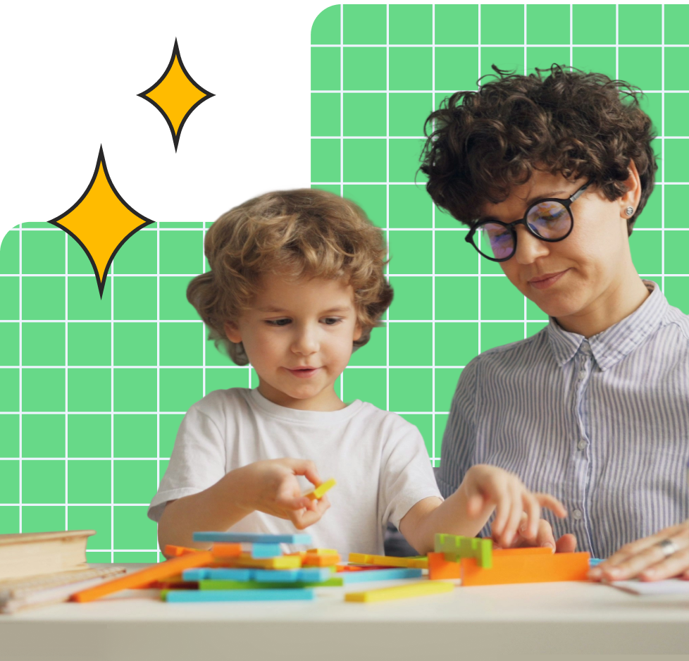 Child playing with colorful blocks at a table while an adult with glasses watches nearby against a green grid background.