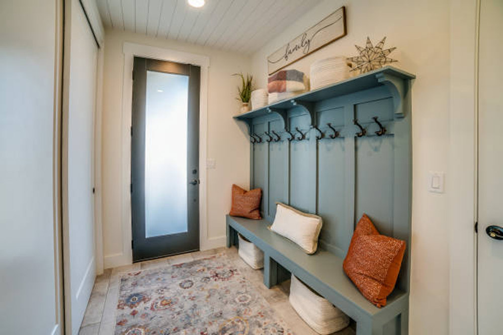 mudroom with blue accent wall 