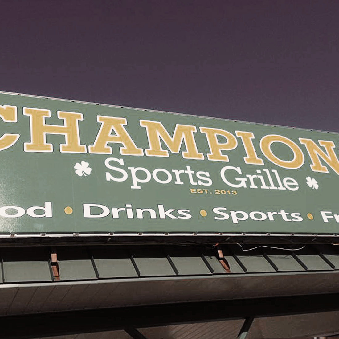 Champions Sports Grille location sign.