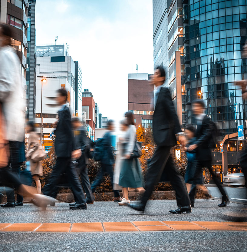 People walking in busy intersection