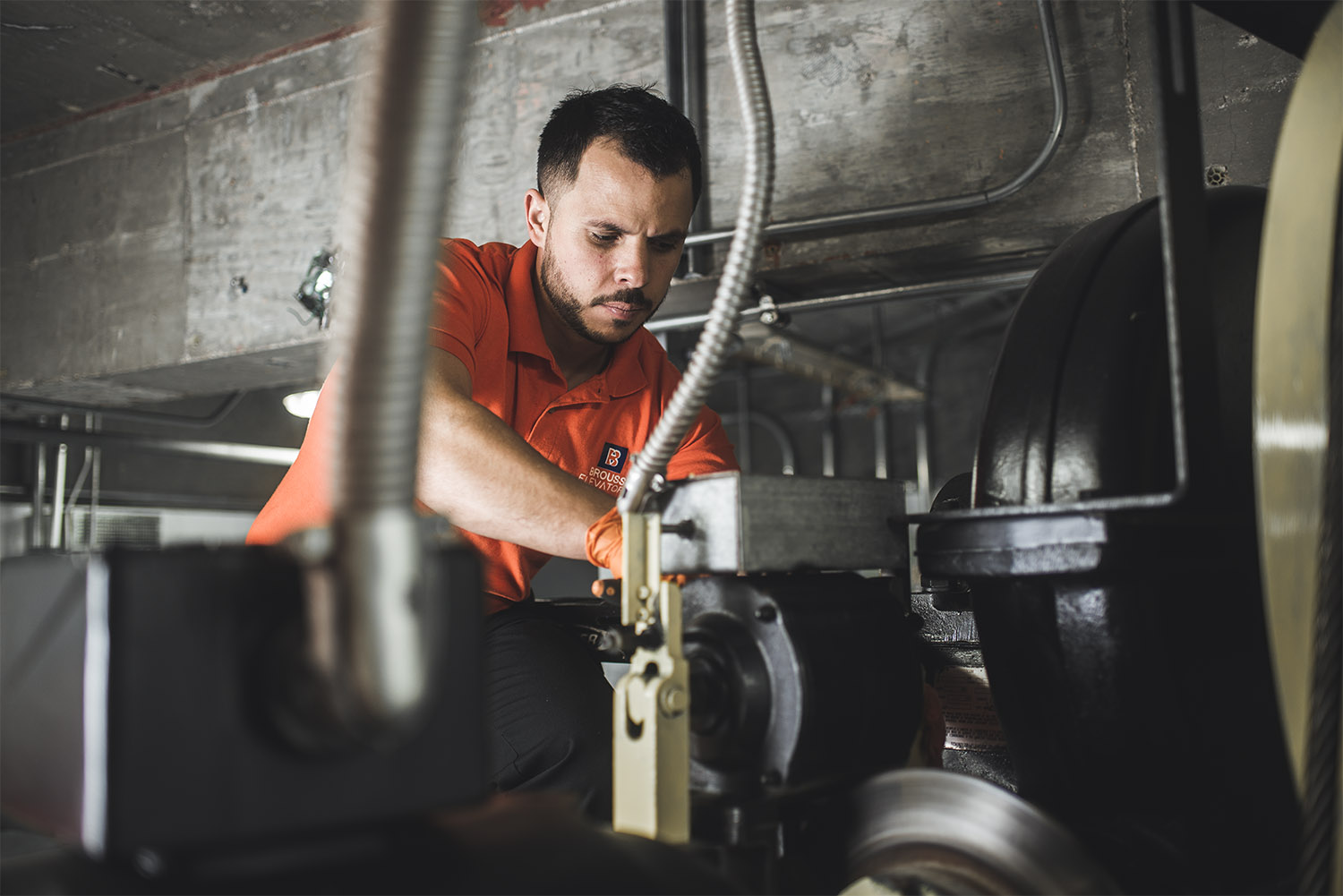 Brouss Elevators Technician working in the machine room 