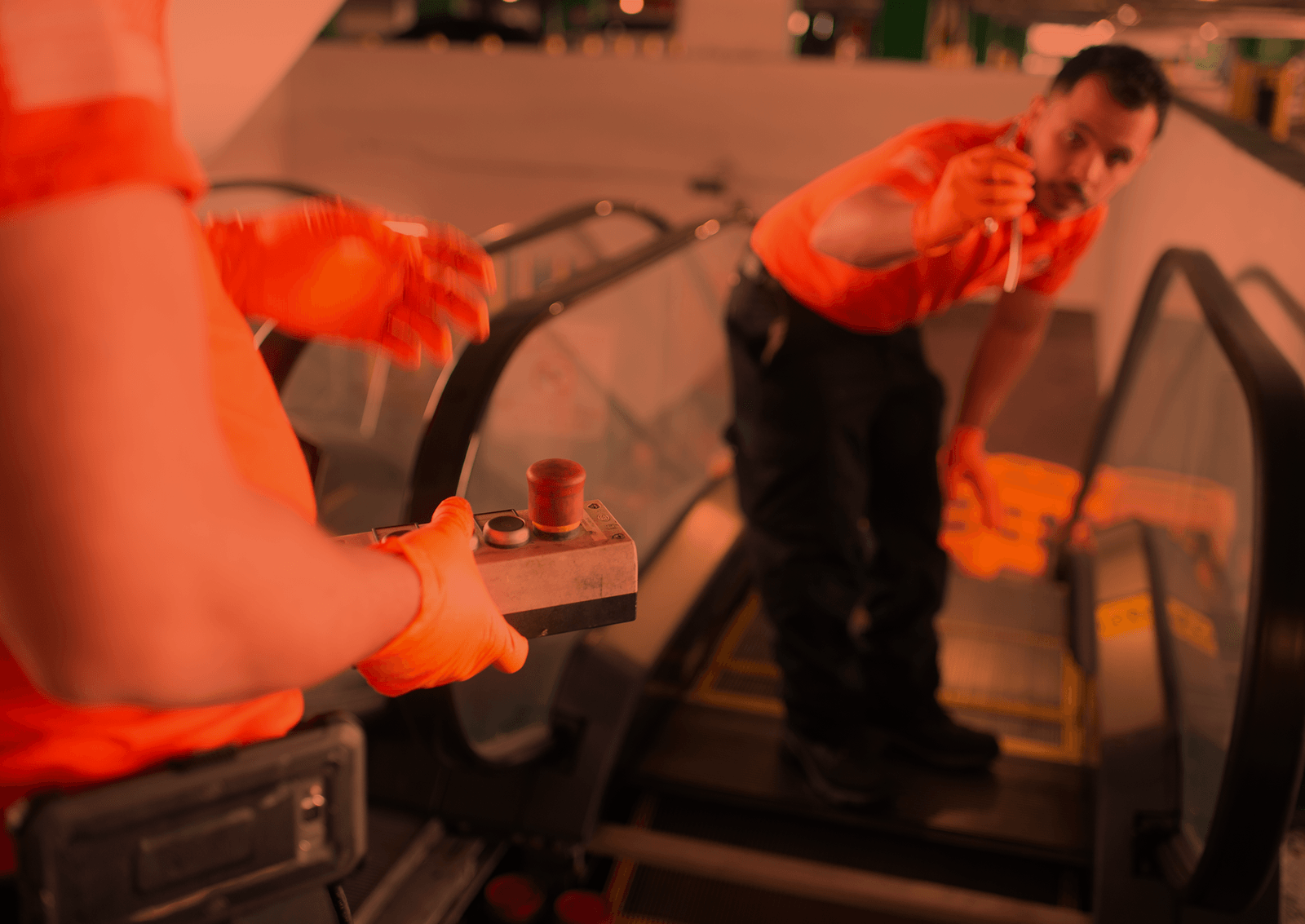 Brouss technicians testing an escalator with the inspection control box