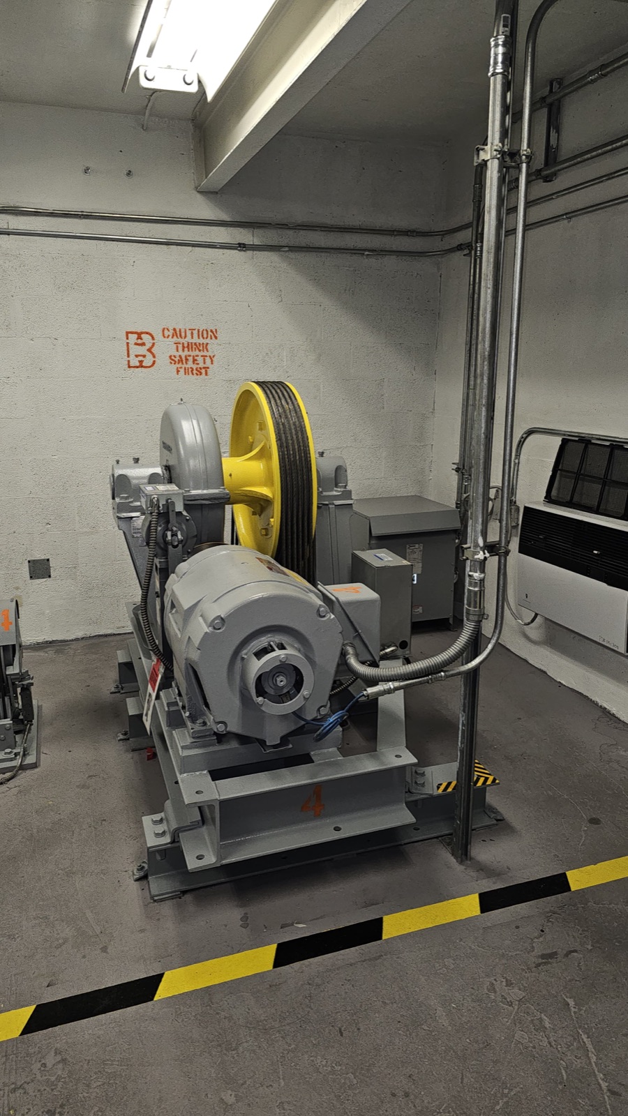New traction machine and sheave in the modernized Olympia Center machine room