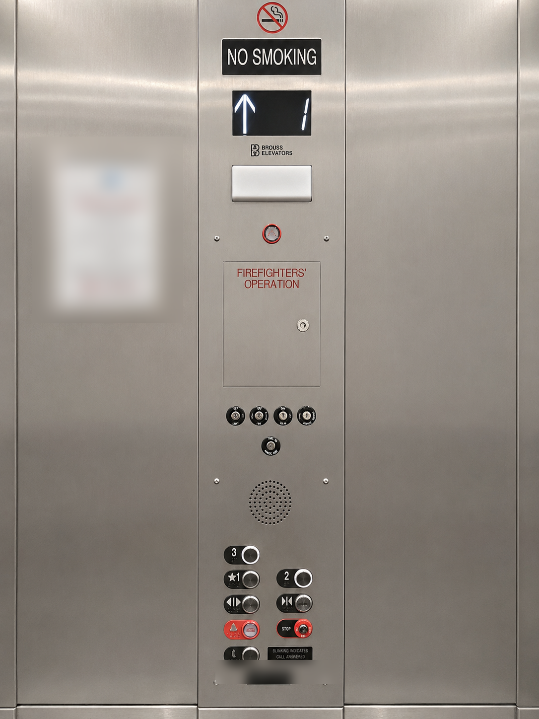 Stainless steel elevator car operating panel with Brouss Elevators branding, firefighters operation and three floor buttons at Cristo Rey Miami