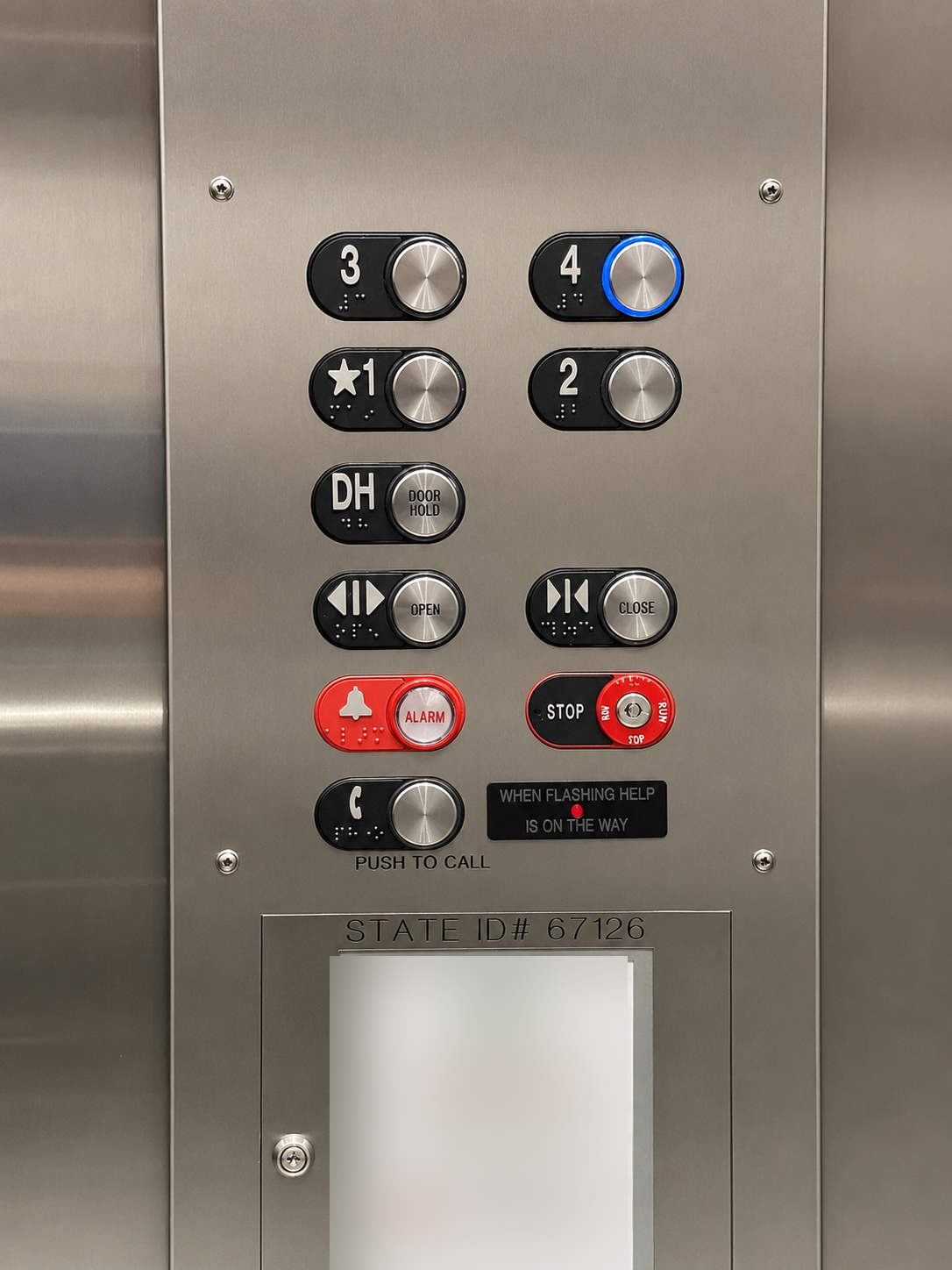 Villa Grande stainless steel elevator car operating panel with braille floor buttons and state inspection ID plate