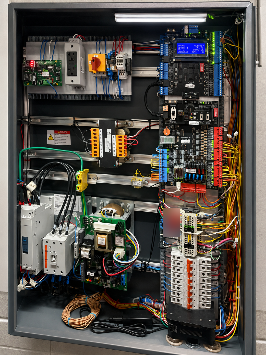 Villa Grande elevator controller interior with new solid-state control boards, drive, and wiring