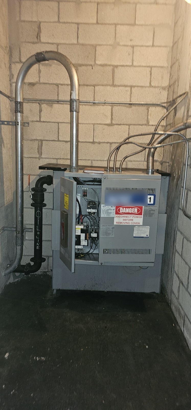 Existing elevator controller cabinet in the machine room at The Wynwood Lofts, modernized to current code
