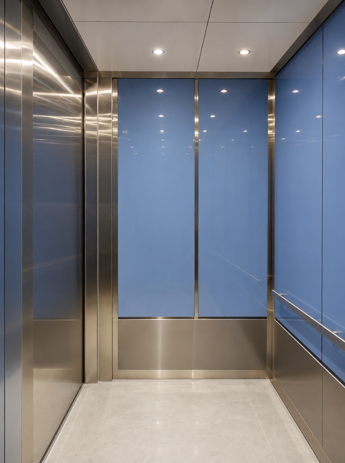 Modernized elevator cab interior with blue glass wall panels and brushed stainless steel at Prestige District in North Miami
