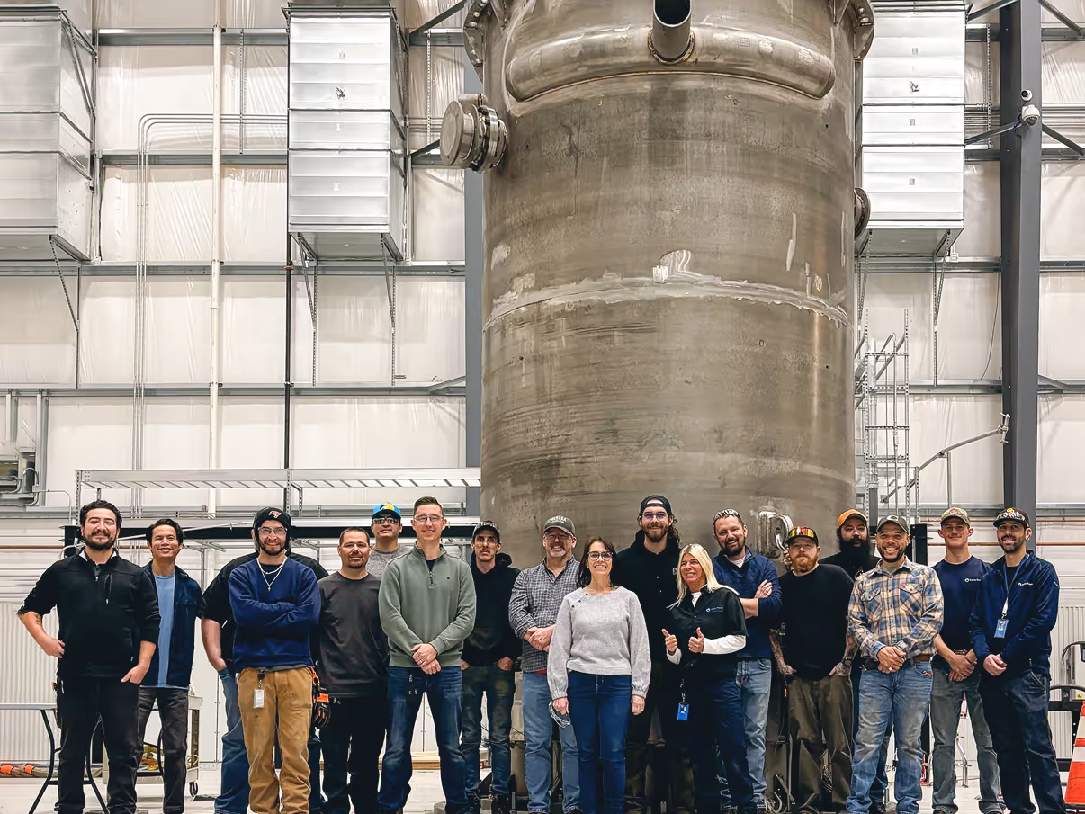 Some of our team in front of a system installation