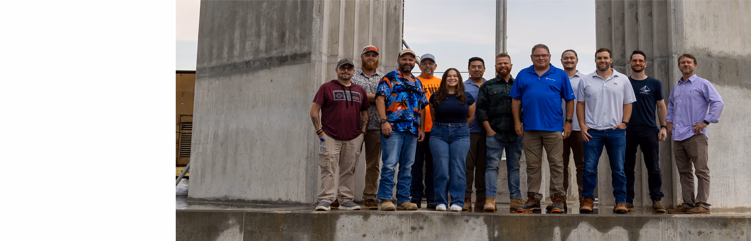 Workers pouring concrete into a form.