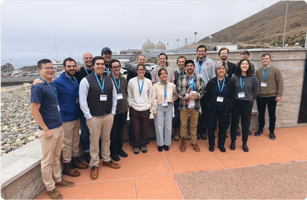 Team photo, outside at an installation