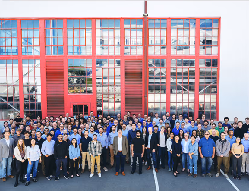 Team photo outside Kairos building