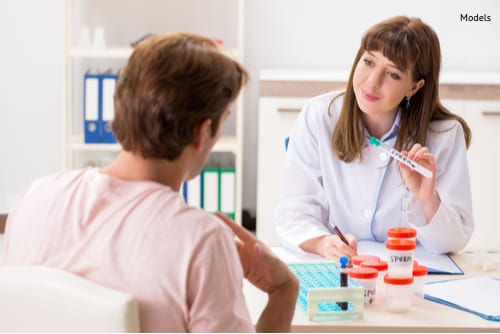 A man visiting a clinic to learn more about the requirements to become a sperm donor.