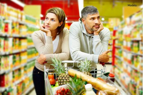 Image of young couple with cart in supermarket-img-blog