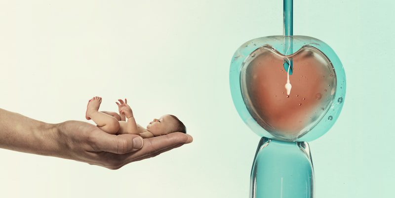 Image of IVF with a photo of a hand holding baby and sperm entering an egg.
