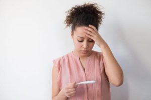 img-blog-Black woman desperate after reading pregnancy test result