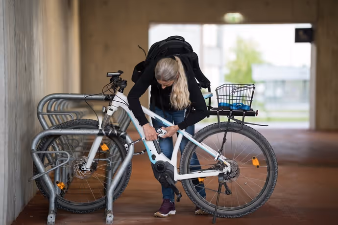 college student secures e-bike with good quality lock