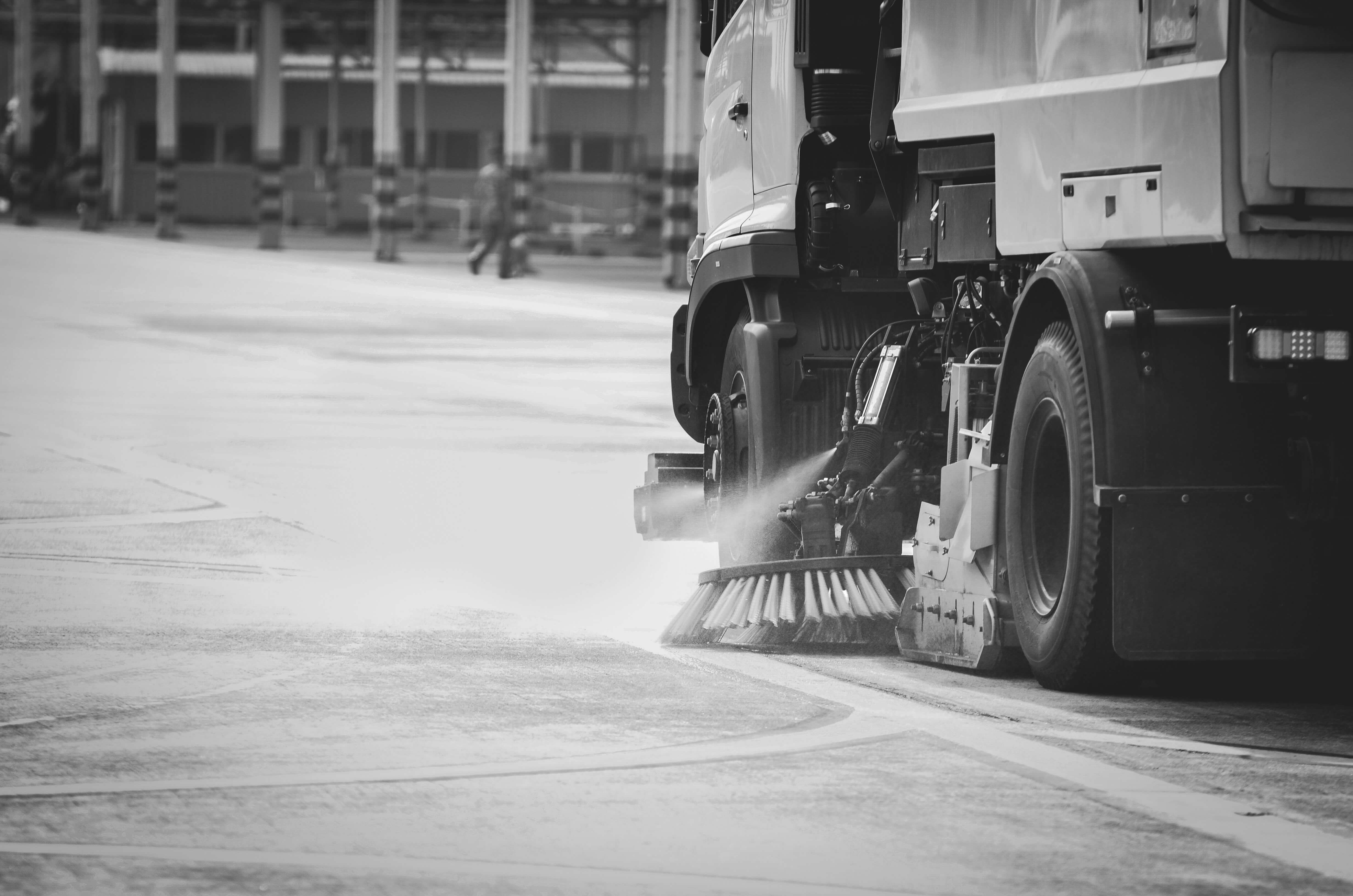 Street sweeper cleaning road.