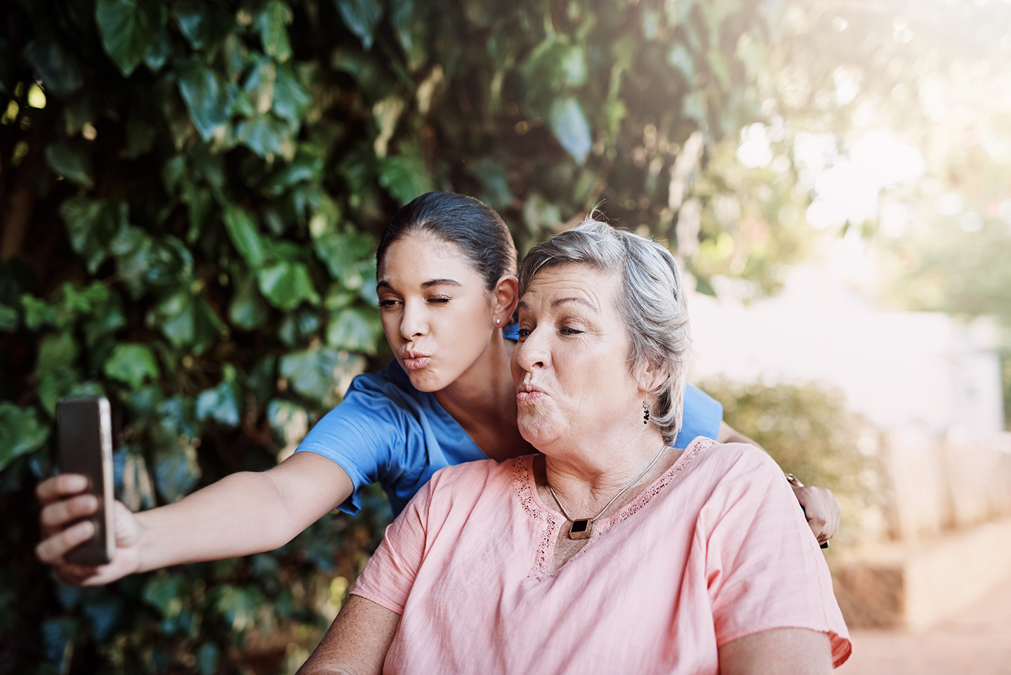 Home caretaker taking duck face selfie with client in yakima.