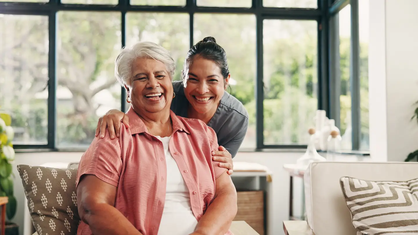 Caregiver giving an elderly women a warm embrace at home in Yakima, representing compassionate elderly care services from Mother's Arms Homecare.