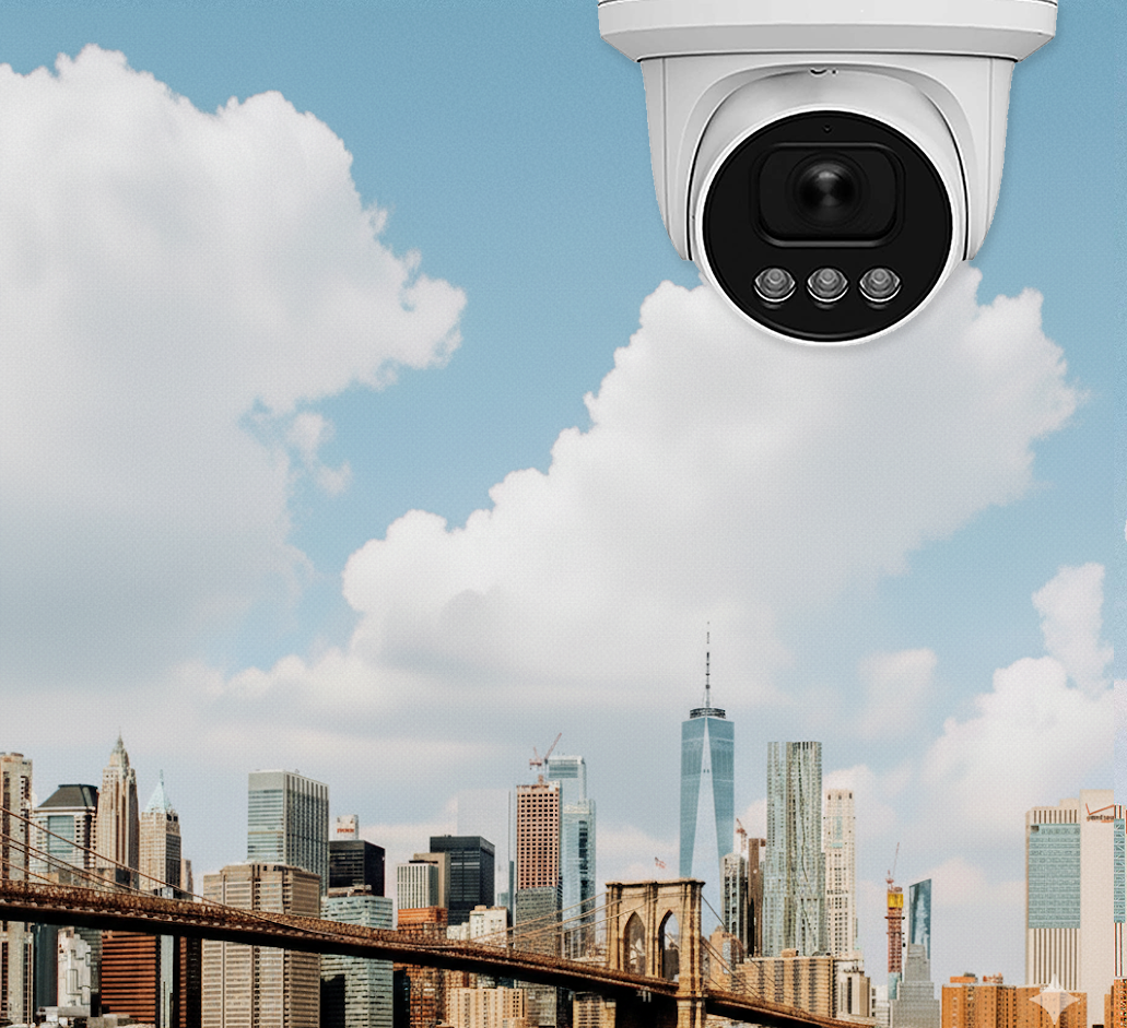 Security camera overlooking New York City skyline with Brooklyn Bridge and One World Trade Center, representing cloud video surveillance and urban security monitoring.