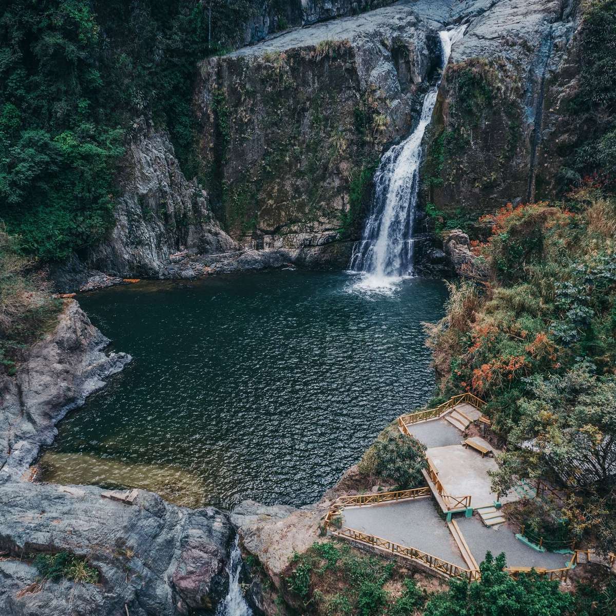 Waterfall and natural pool surrounded by forest in Jarabacoa, Dominican Republic