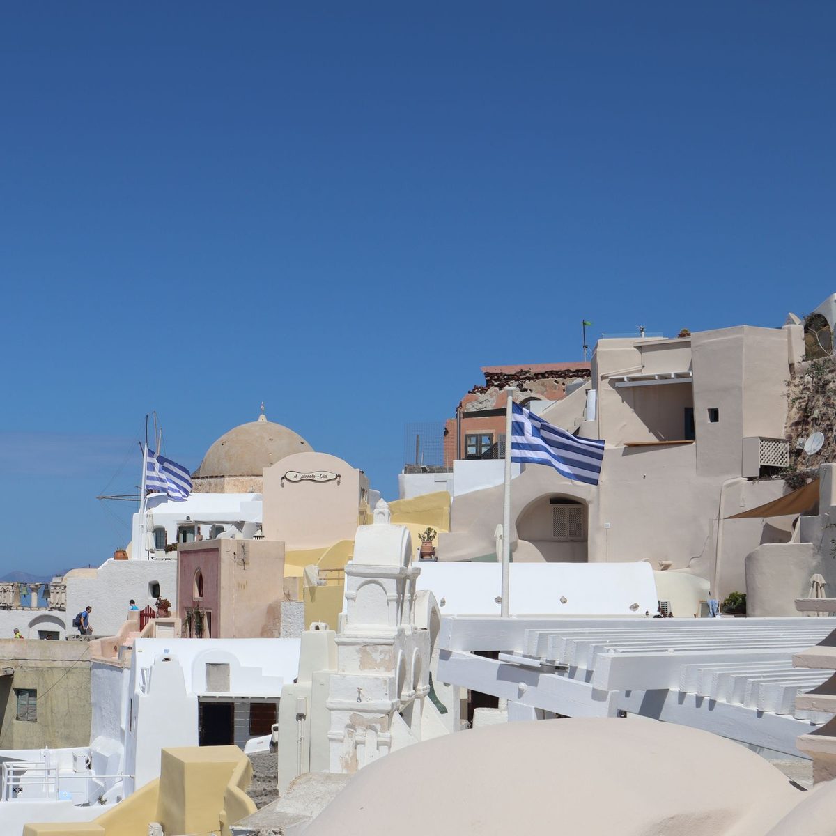 Whitewashed houses and blue domes of Oia, Santorini, Greece