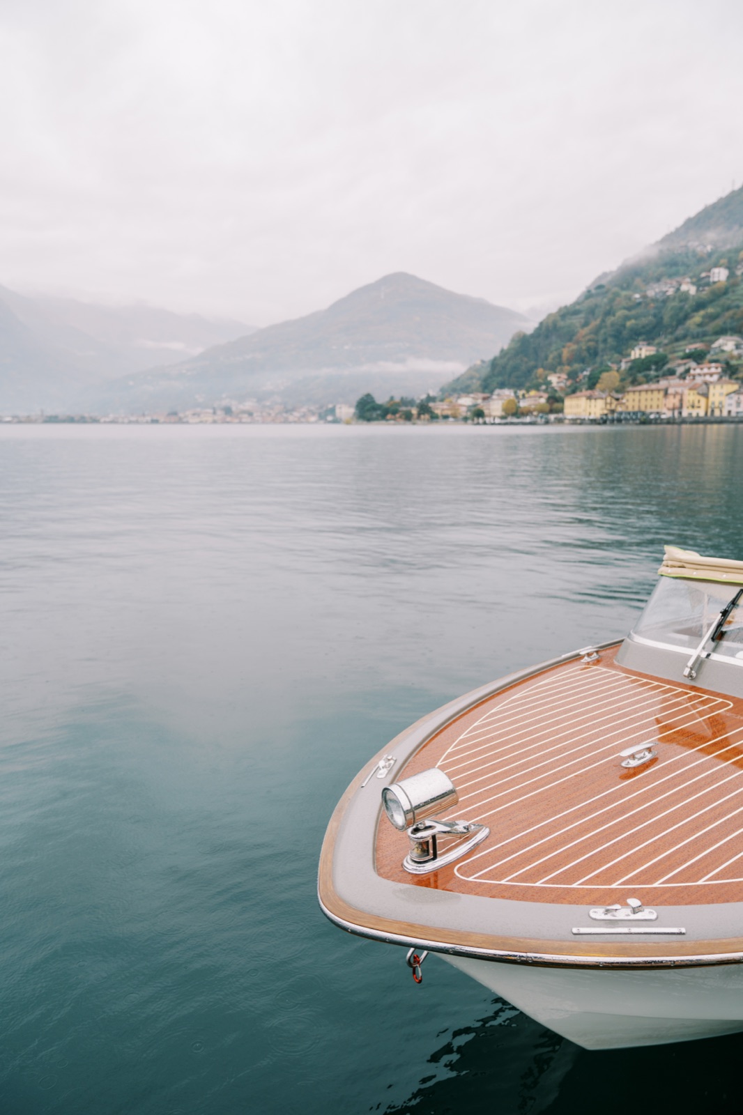A classic wooden boat moored on Lake Como.