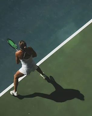 Woman playing tennis on an outdoor court