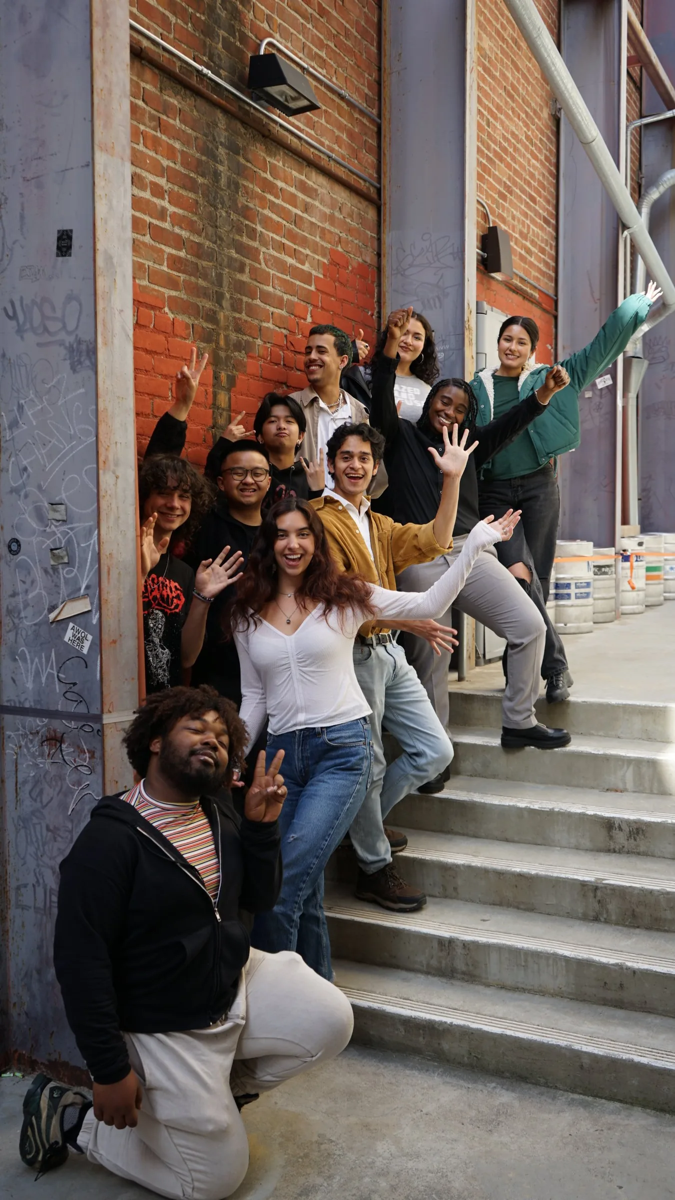 Concert Career Pathways participants celebrating on the stairs outside The UC Theatre
