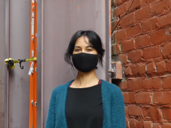 Photo of intern Gabriela Velez with mask on
