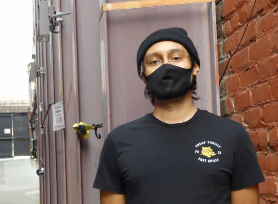 Photo of intern Marco Alvarado with mask on