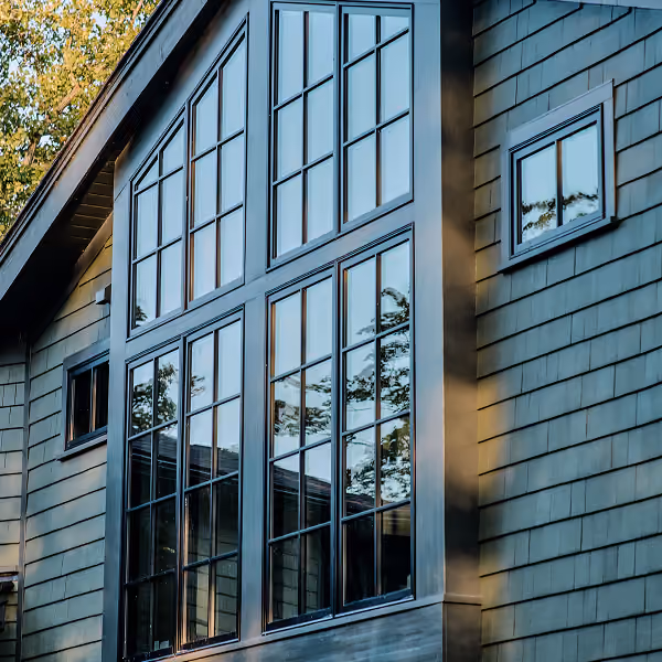 Home exterior painted in Artifact, blending naturally with the surroundings while maintaining a fresh appearance.