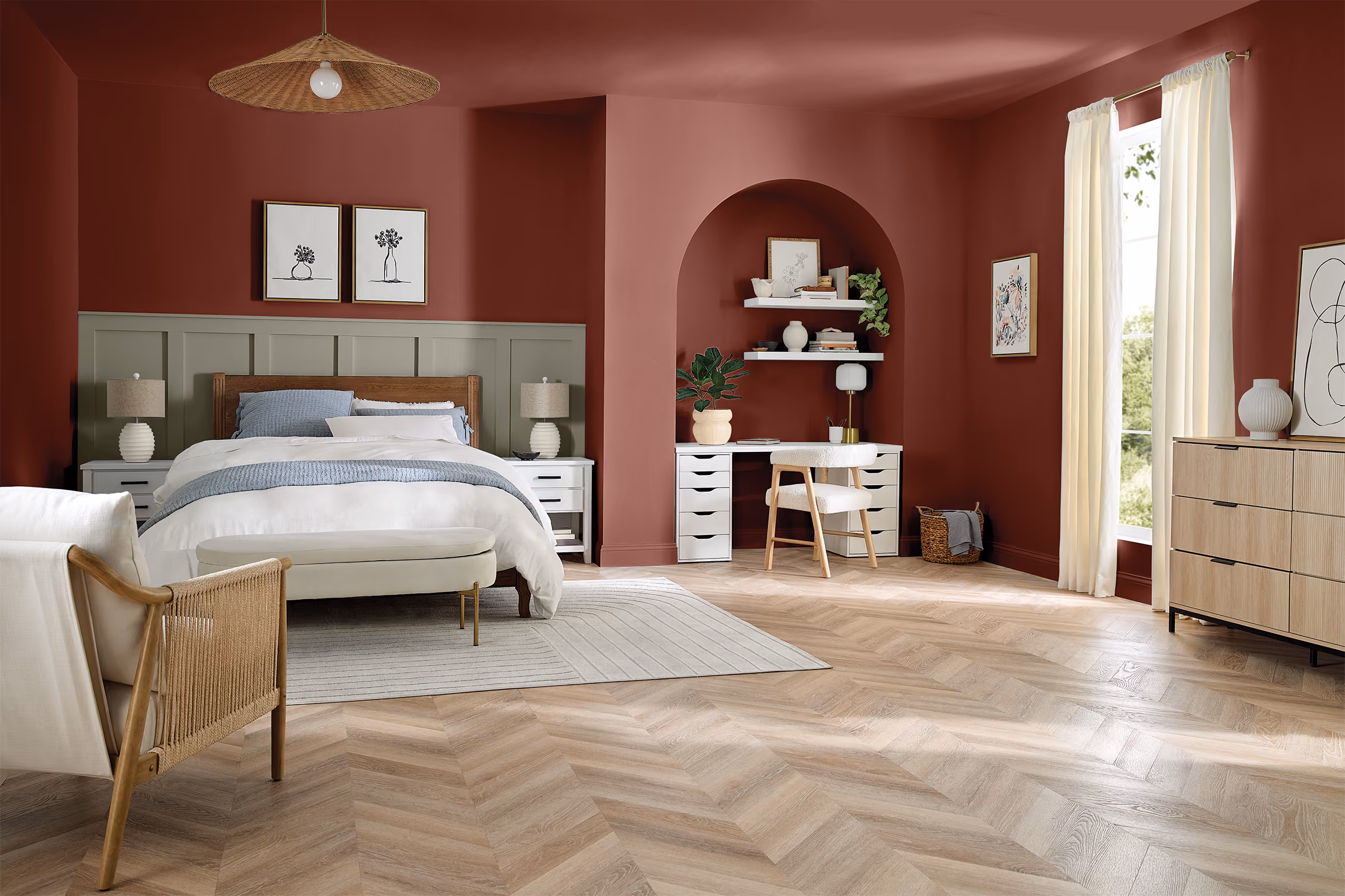 Spacious bedroom with rich reddish-brown walls and a large arched doorway