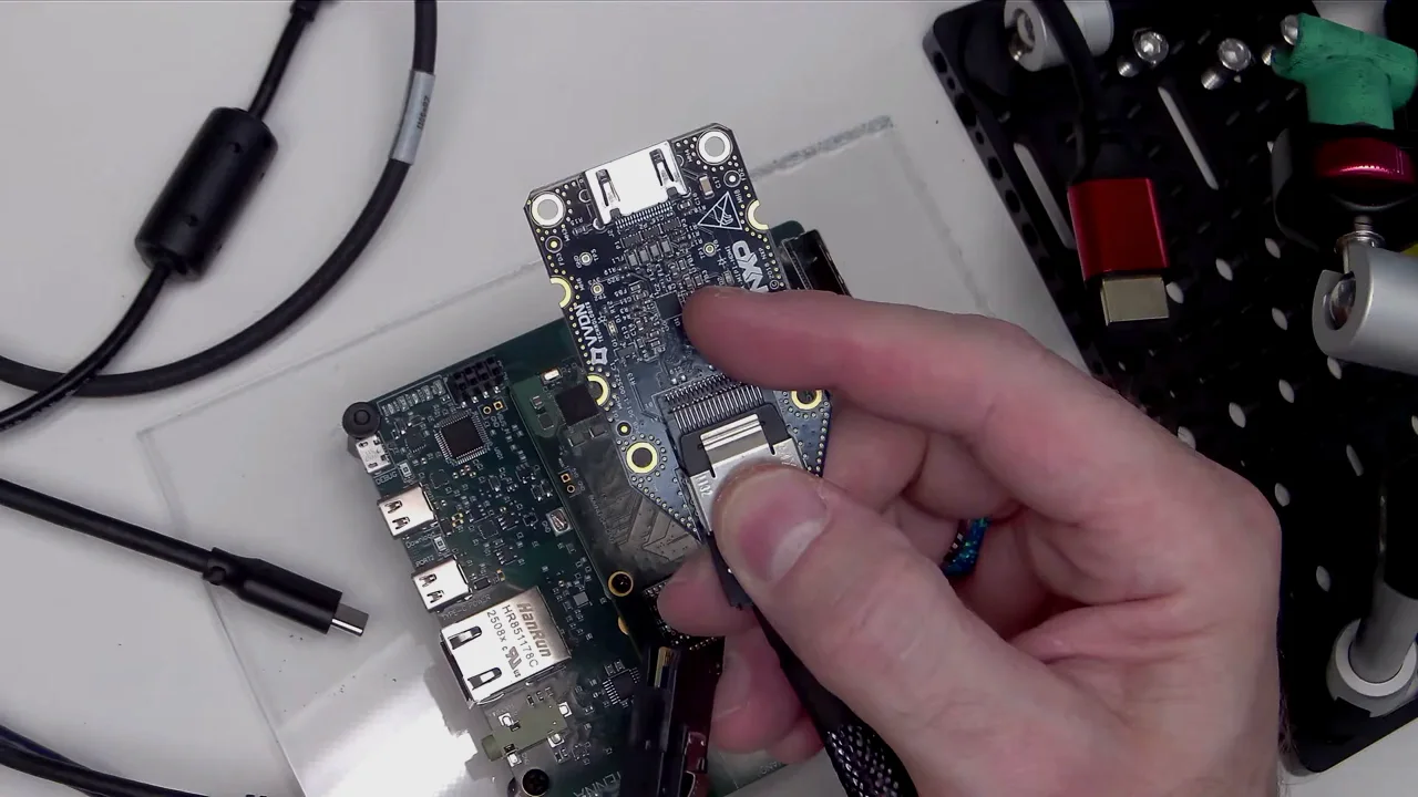 The Quilter-designed Speedrun module being seated onto its baseboard during bring-up