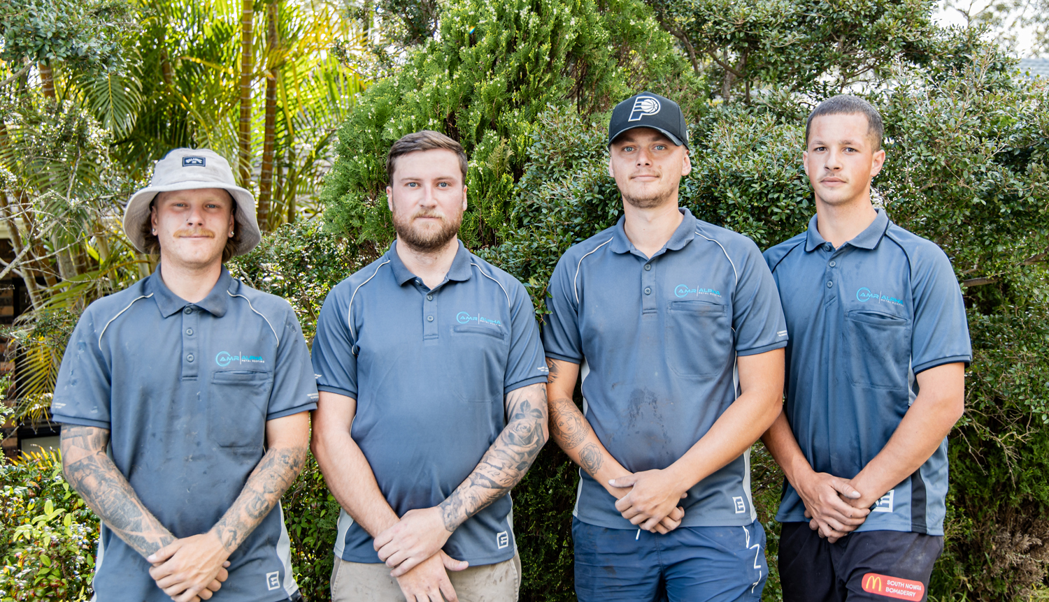 A group of men smiling