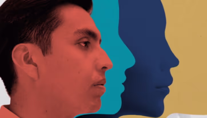 Profile of a man in red with blue silhouettes behind him.