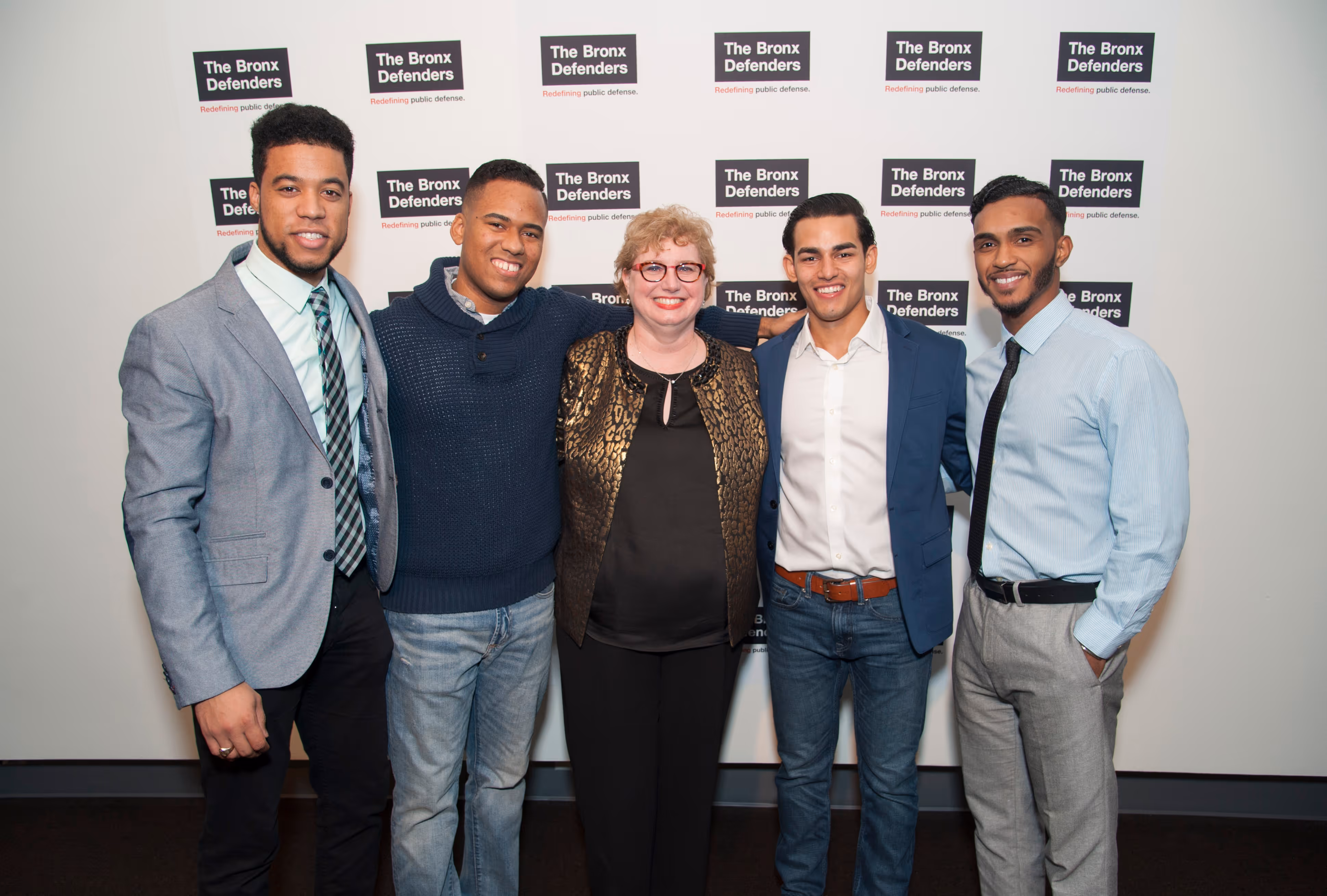 Group of individuals posing at an event for The Bronx Defenders.