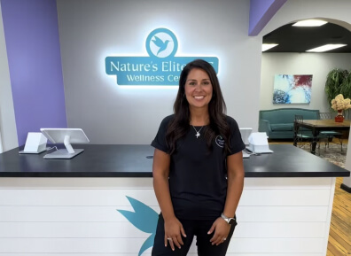 Diana standing in front of desk