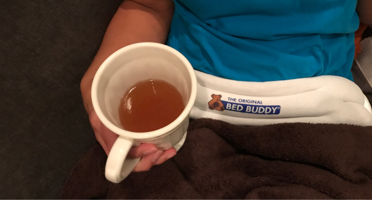 Drinking bone broth with my heating pad on my hips trying to feel better.