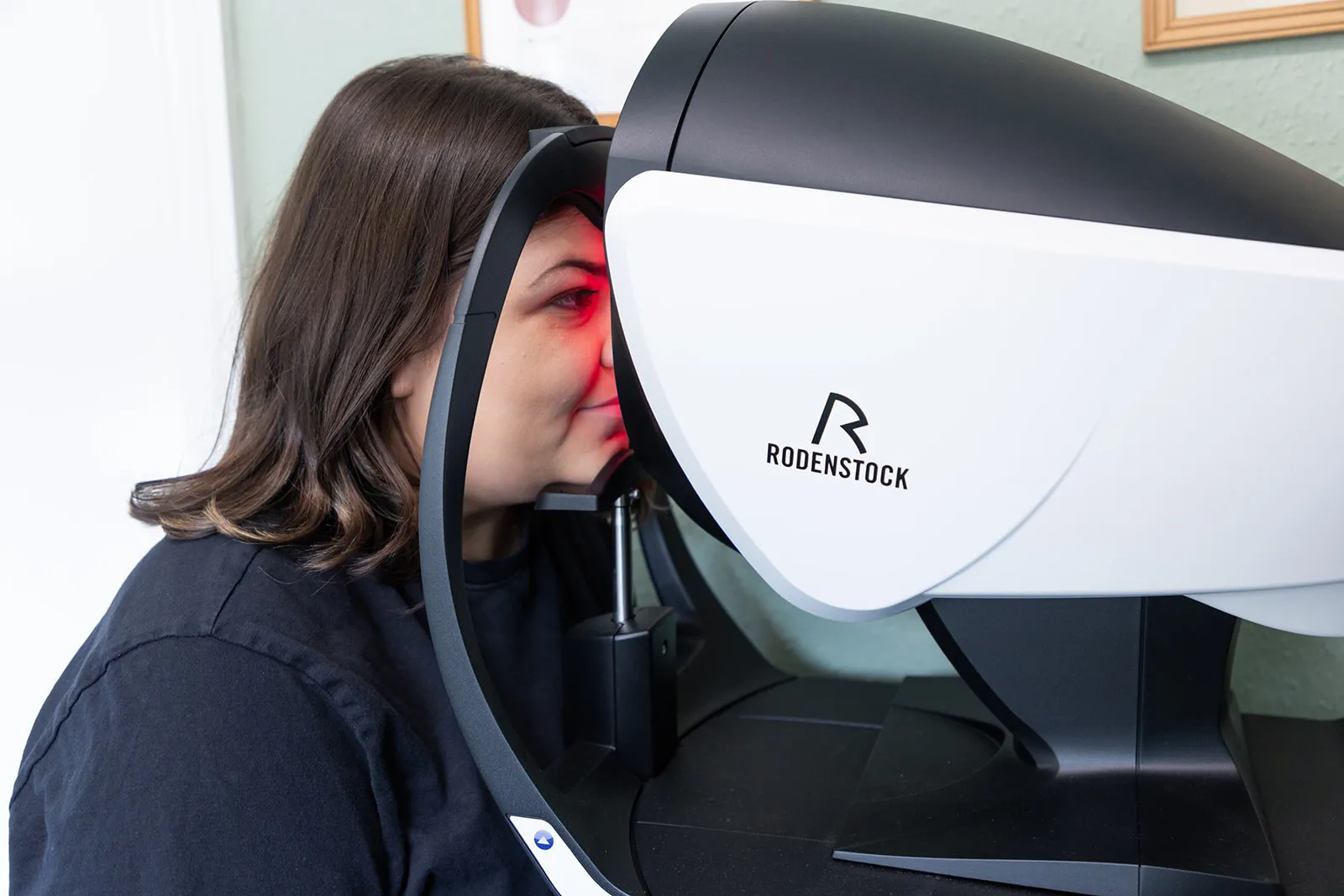Person receiving eye examination with Rodenstock optical equipment