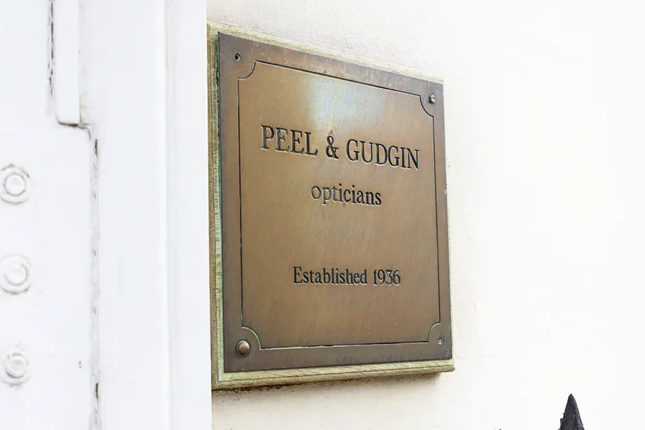 Bronze plaque for Peel & Gudgin opticians, established in 1936