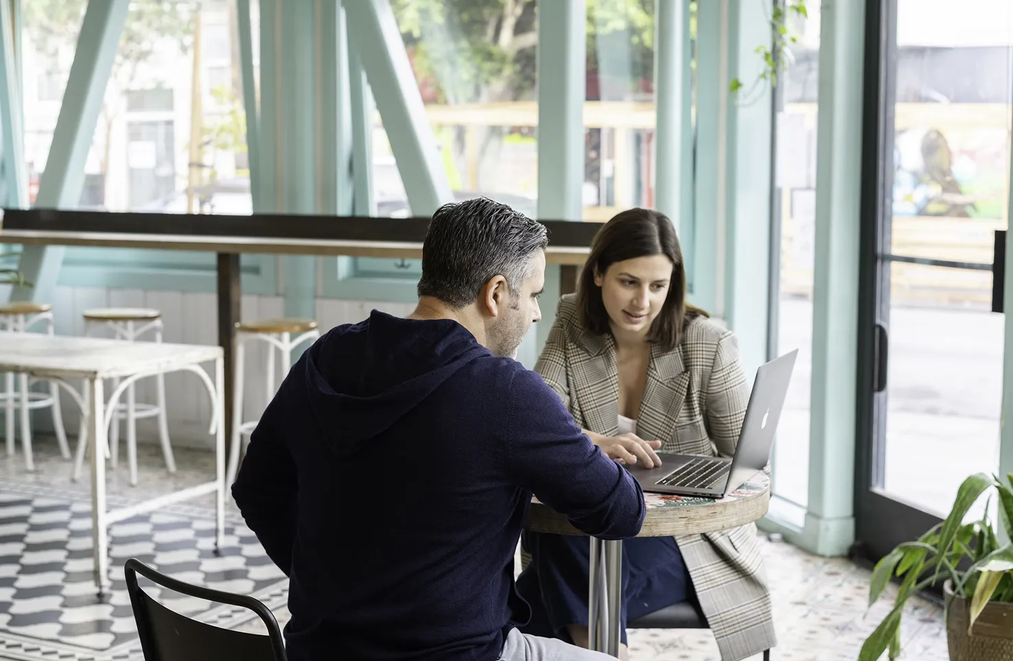 A man talking to a woman