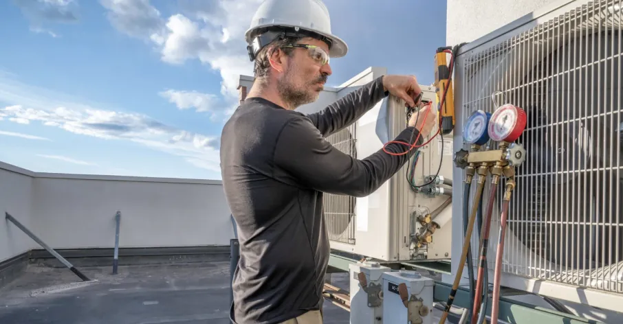 A skilled technician expertly servicing an HVAC unit in a home, highlighting our commitment to urgent and professional HVAC repair.
