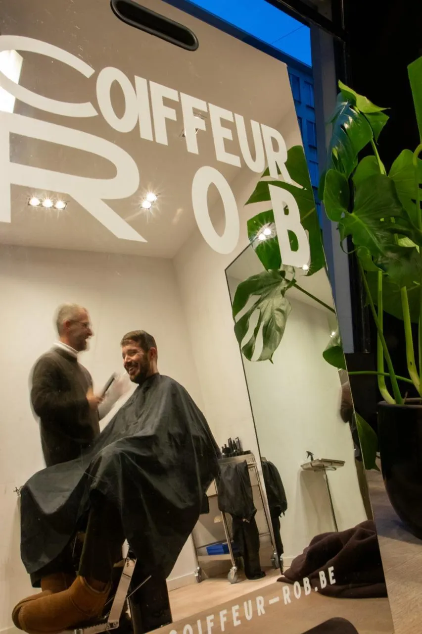 Modern open living space with fireplace and large windows