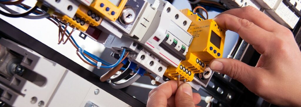 A photograph of a man's hands as he adjusts an internal computer piece.
