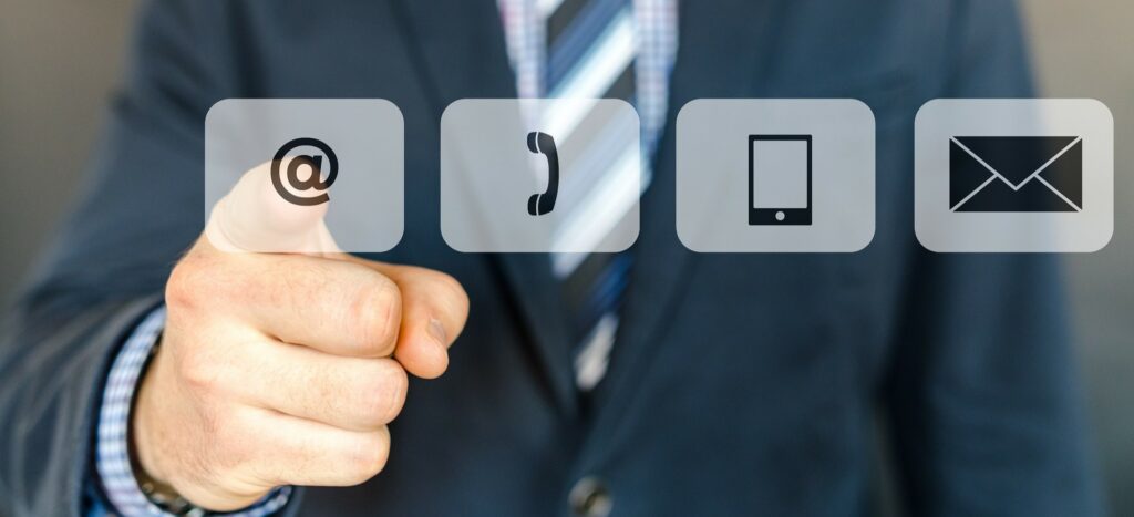 A photograph of a man's finger selecting a touchscreen option. 