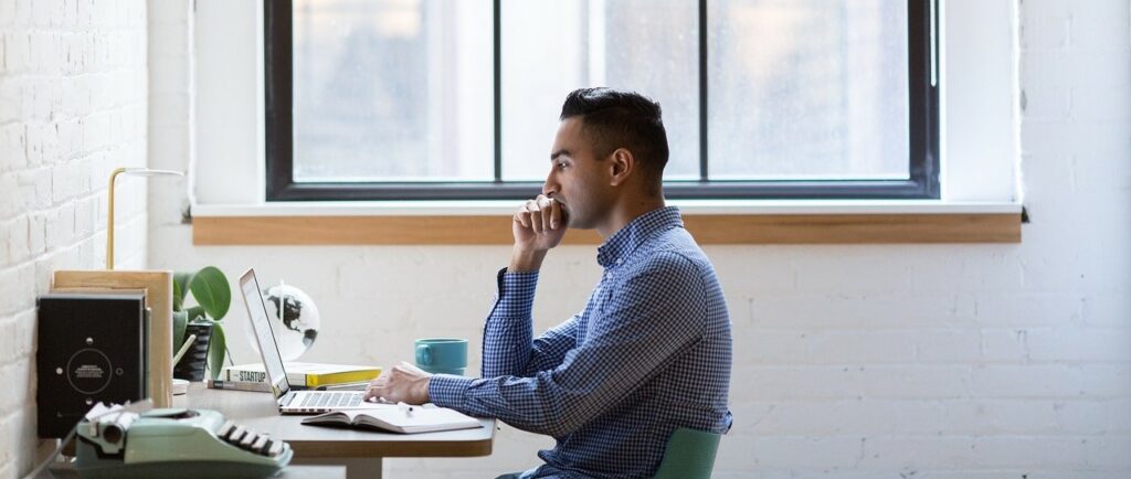 A man is working on his laptop.