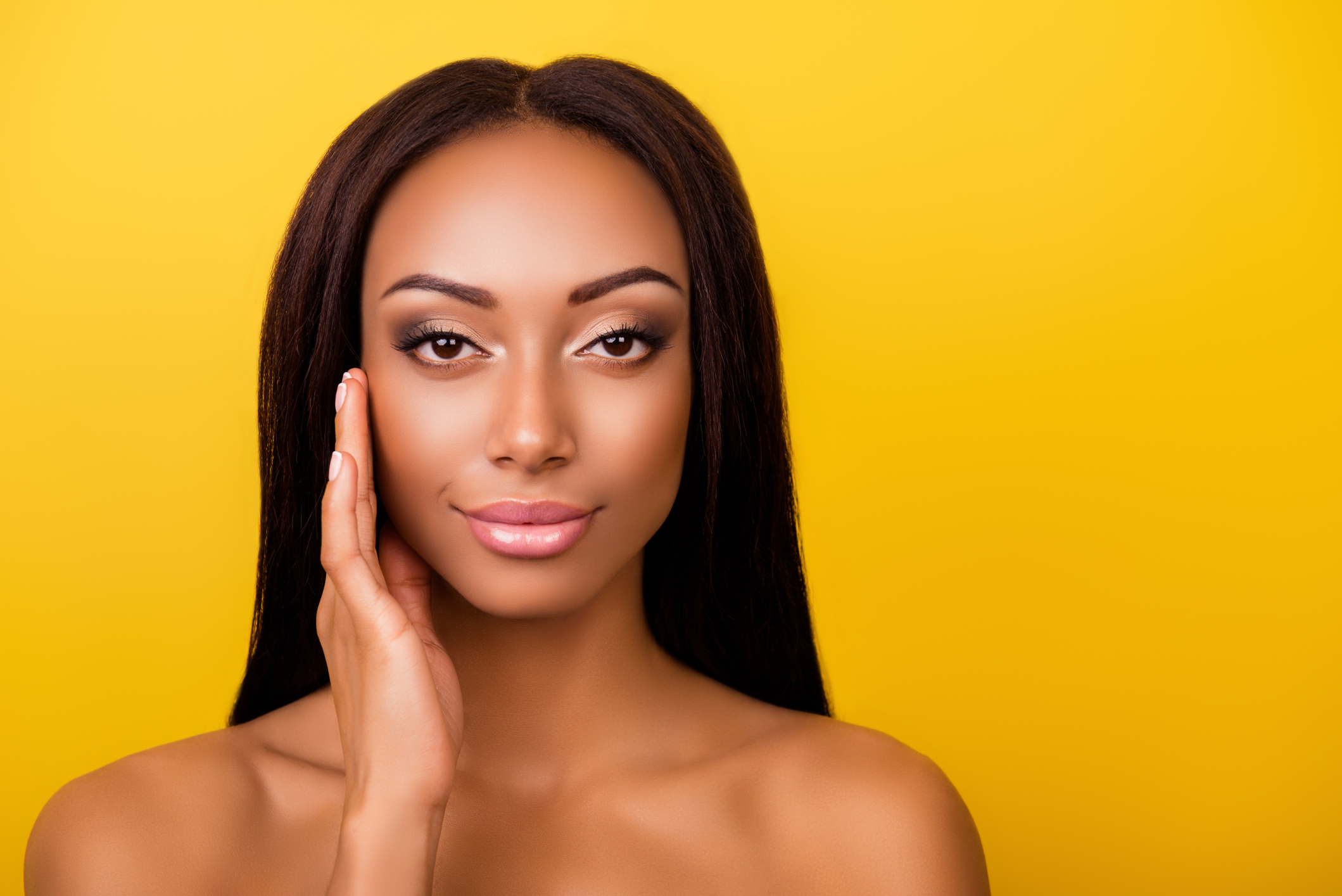 Perfection is a hard work! Pampering, pimple, wrinkle, clear and clean, oily, dry skin concept. Cose up cropped photo of afro gorgeous charming brunette touching gently her ideal face