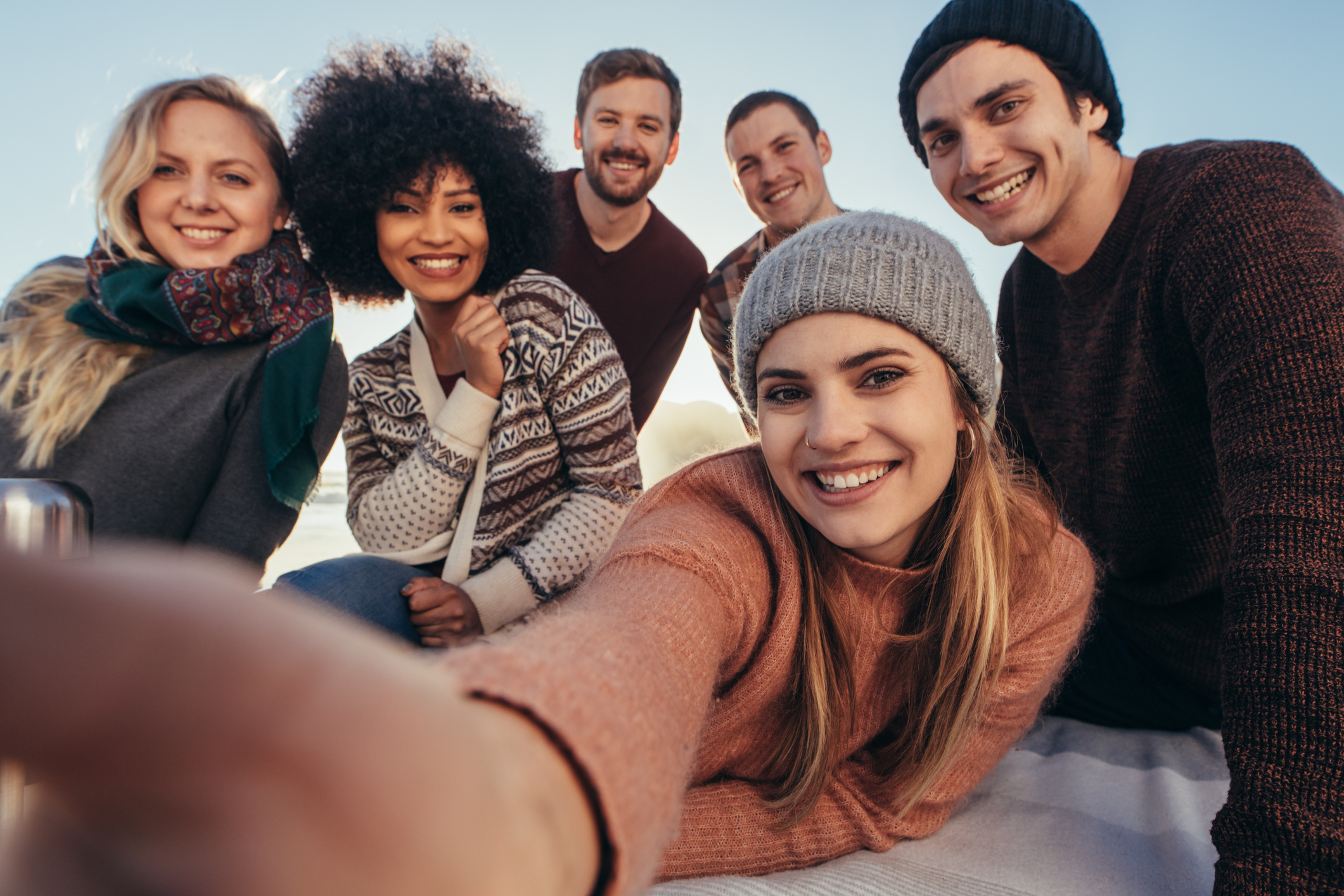 Friends taking selfie during beach party
